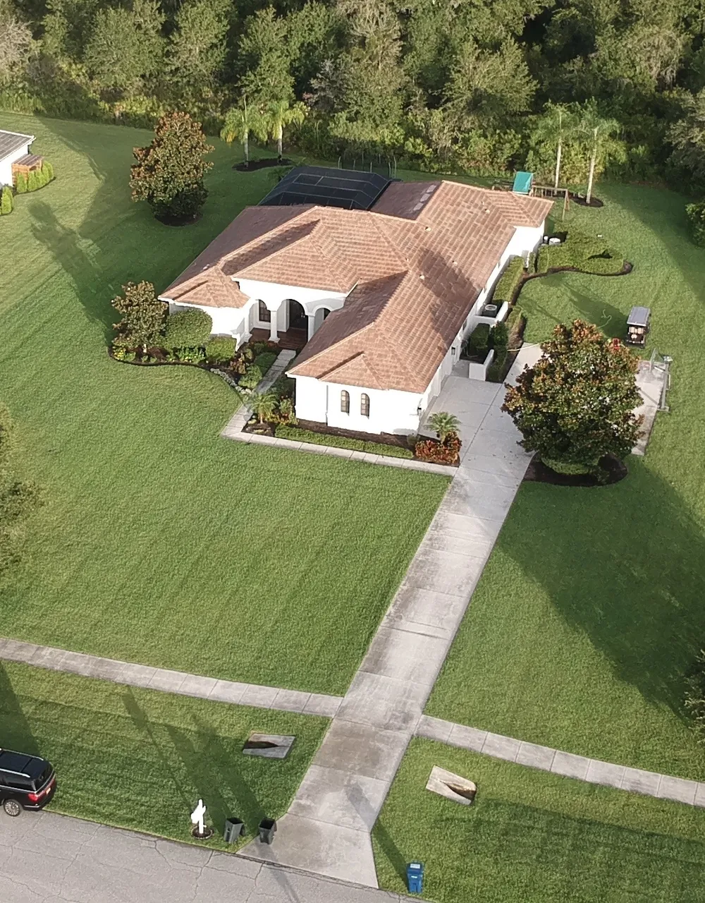 Stained driveway before full driveway package in Bradenton