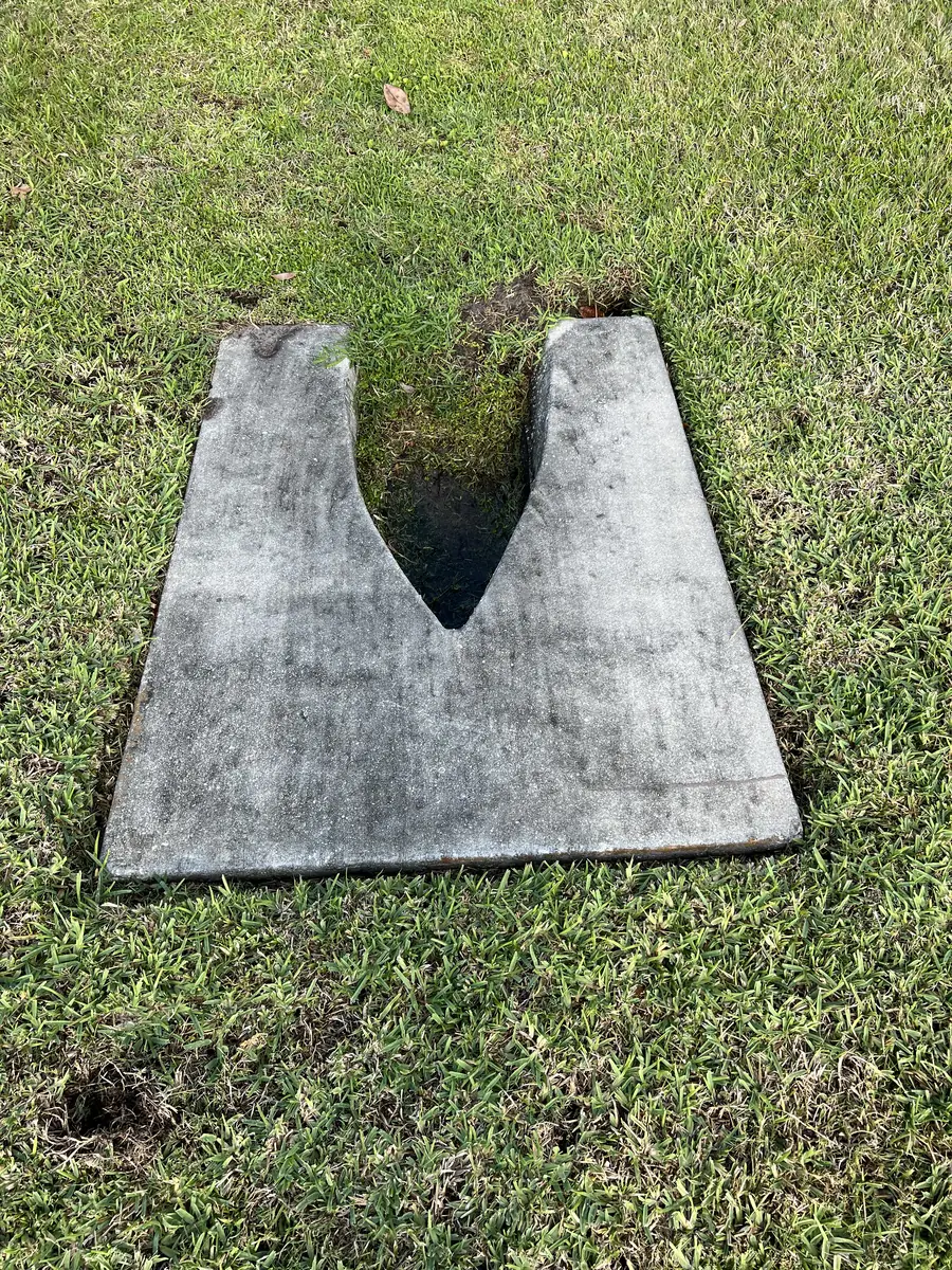 Mold and algae on concrete culvert before cleaning in Manatee County